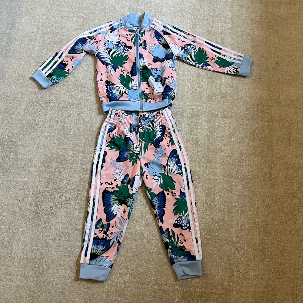 HER STUDIO LONDON TRANSFORMS THIS CLASSIC TRACK SUIT WITH A PLAYFUL PRINT